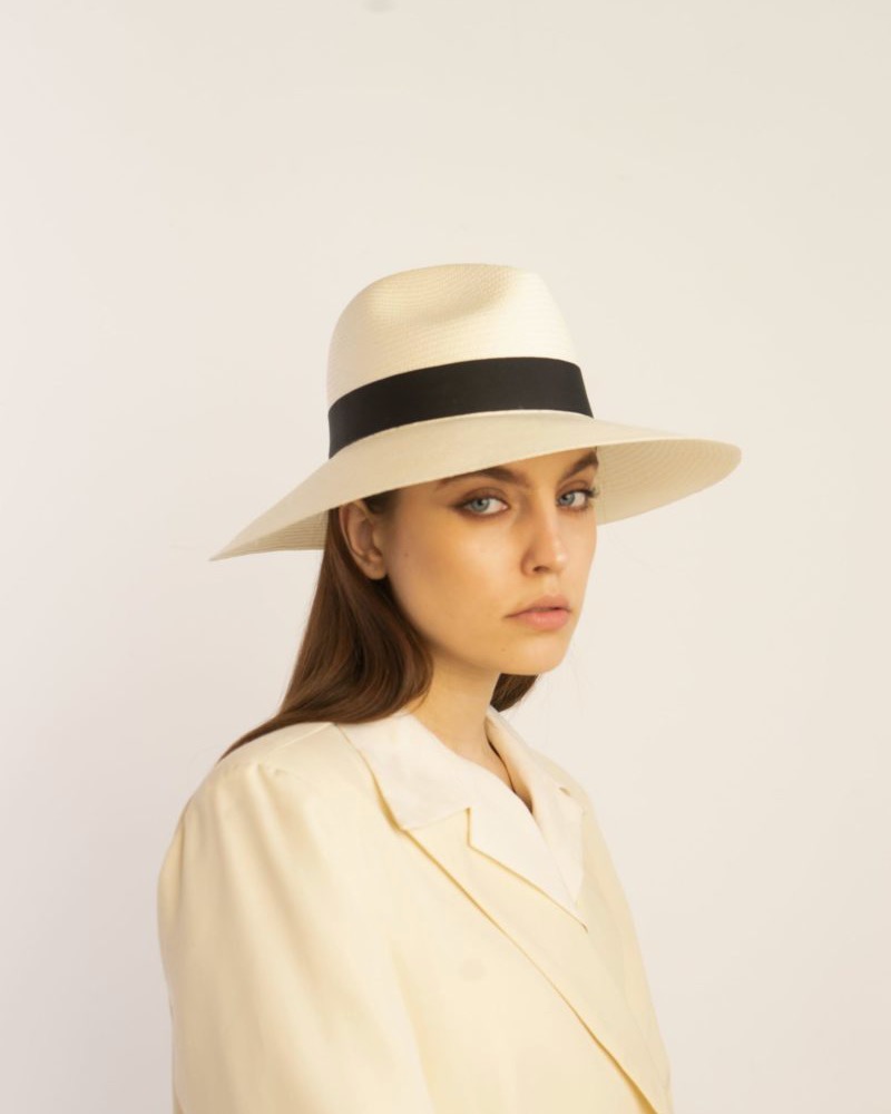 Wide-brimmed fedora with black ribbon